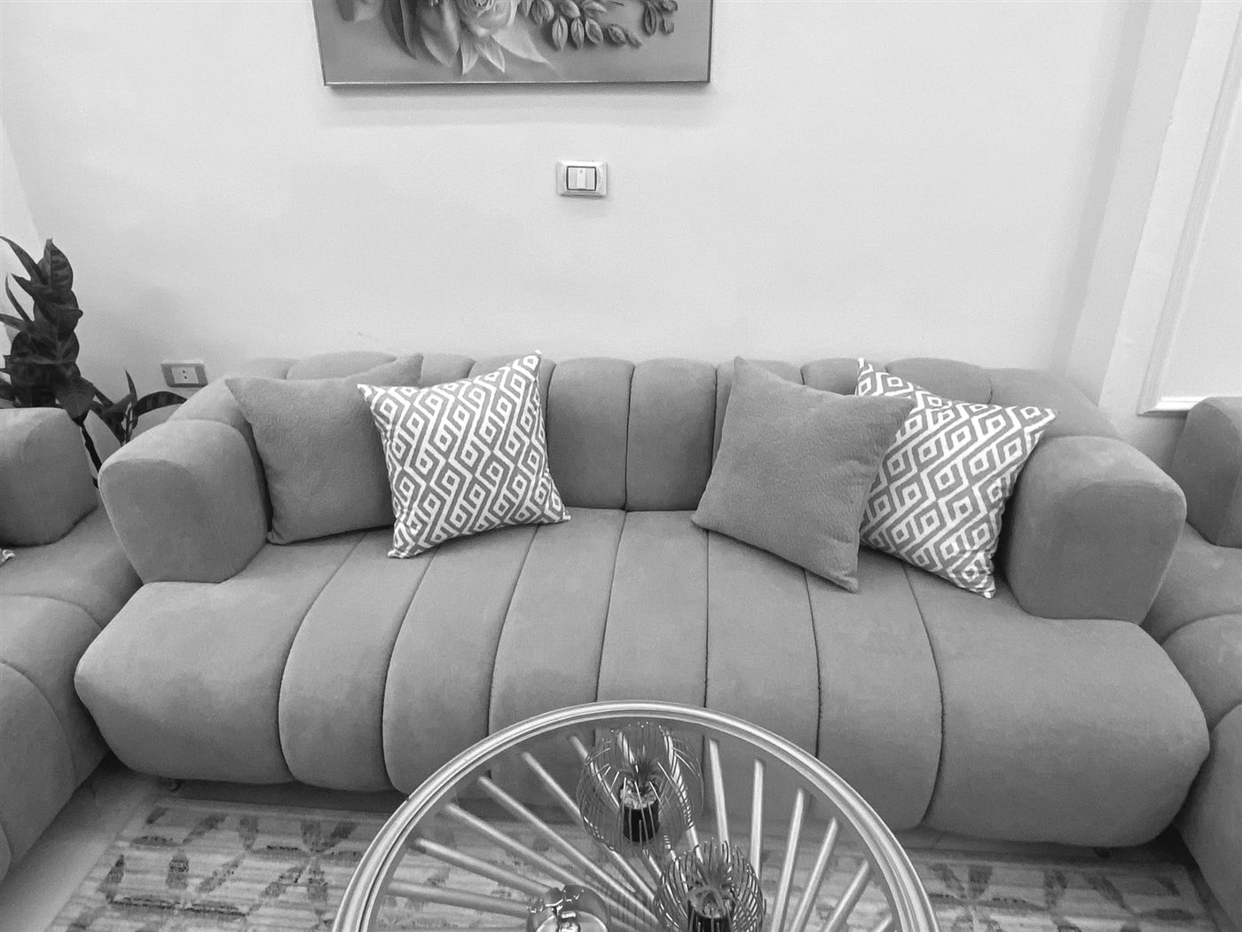 Grayscale design-study version of the channel-tufted sofa